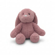Dusky pink bunny Snuggable Hottie plush with swing tag on a white background