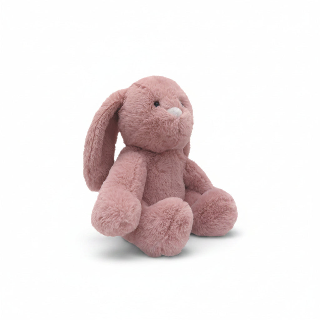 Pink bunny Snuggable Hottie seated in profile showing long floppy ears