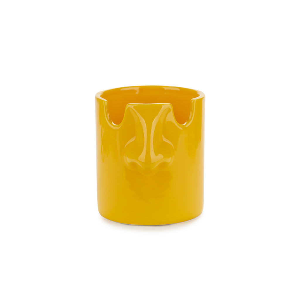 Back of the mustard yellow nose pen holder showing the notch for glasses