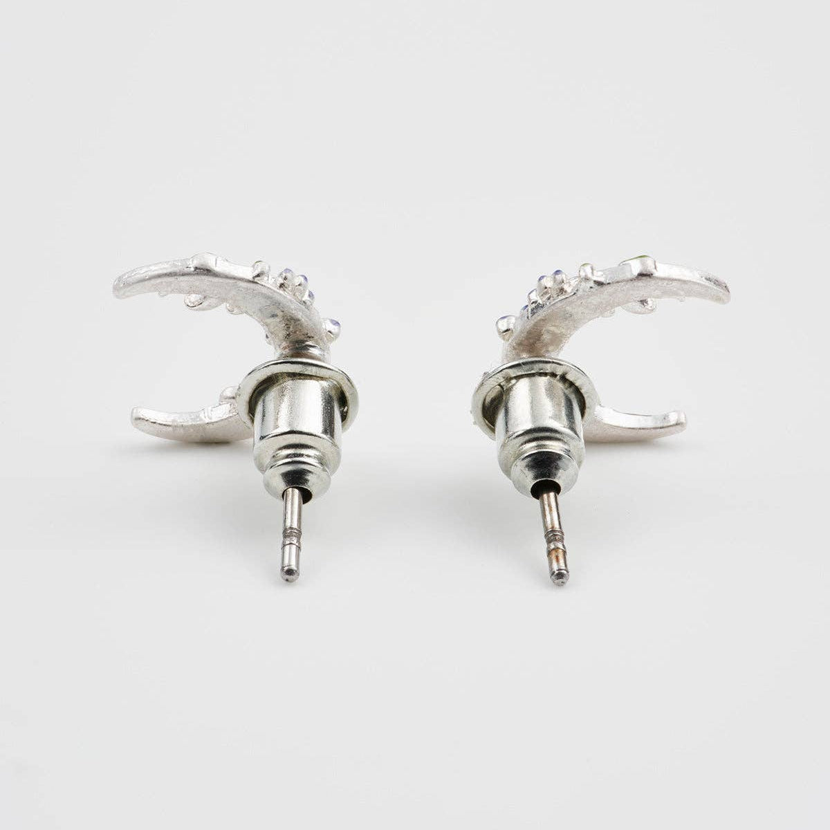 Nightshade Moon silver stud earrings, styled product photograph