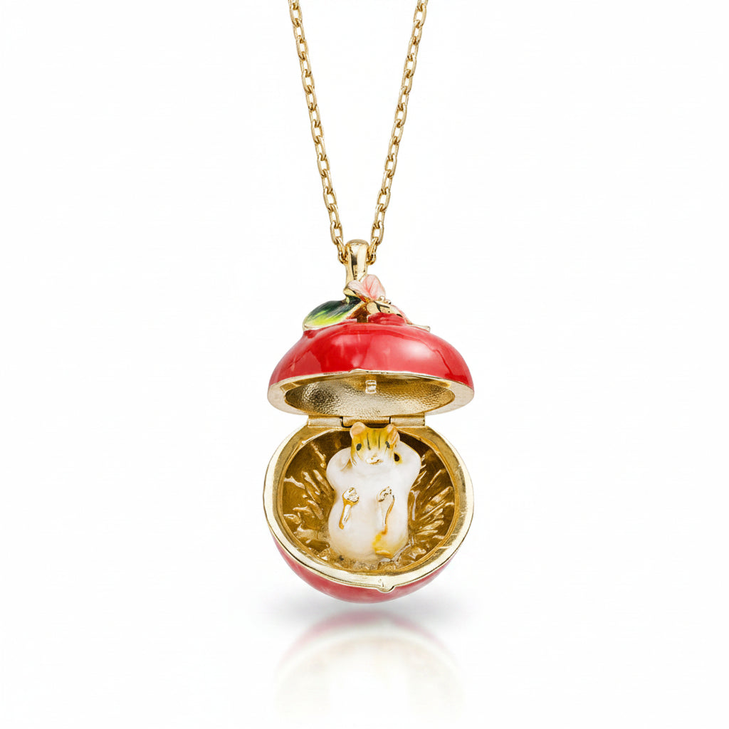 Open apple blossom and mouse locket pendant showing mouse detail on white background