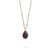 Bill Skinner Blackberry Pendant, dark berry with gold cap on a fine gold chain, on white