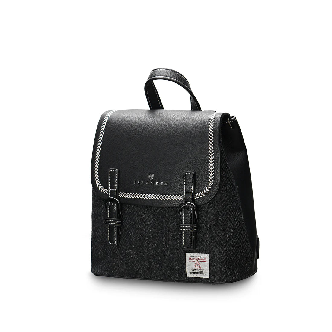 Angled view of Black Herringbone Harris Tweed Mini Jura backpack with buckle detail.