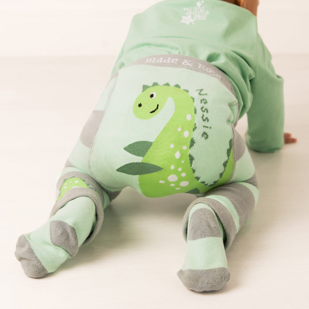 Baby on all fours showing the Nessie applique across the leggings bottom