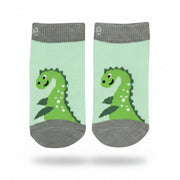 Pair of green and grey striped Nessie socks laid flat on a green background