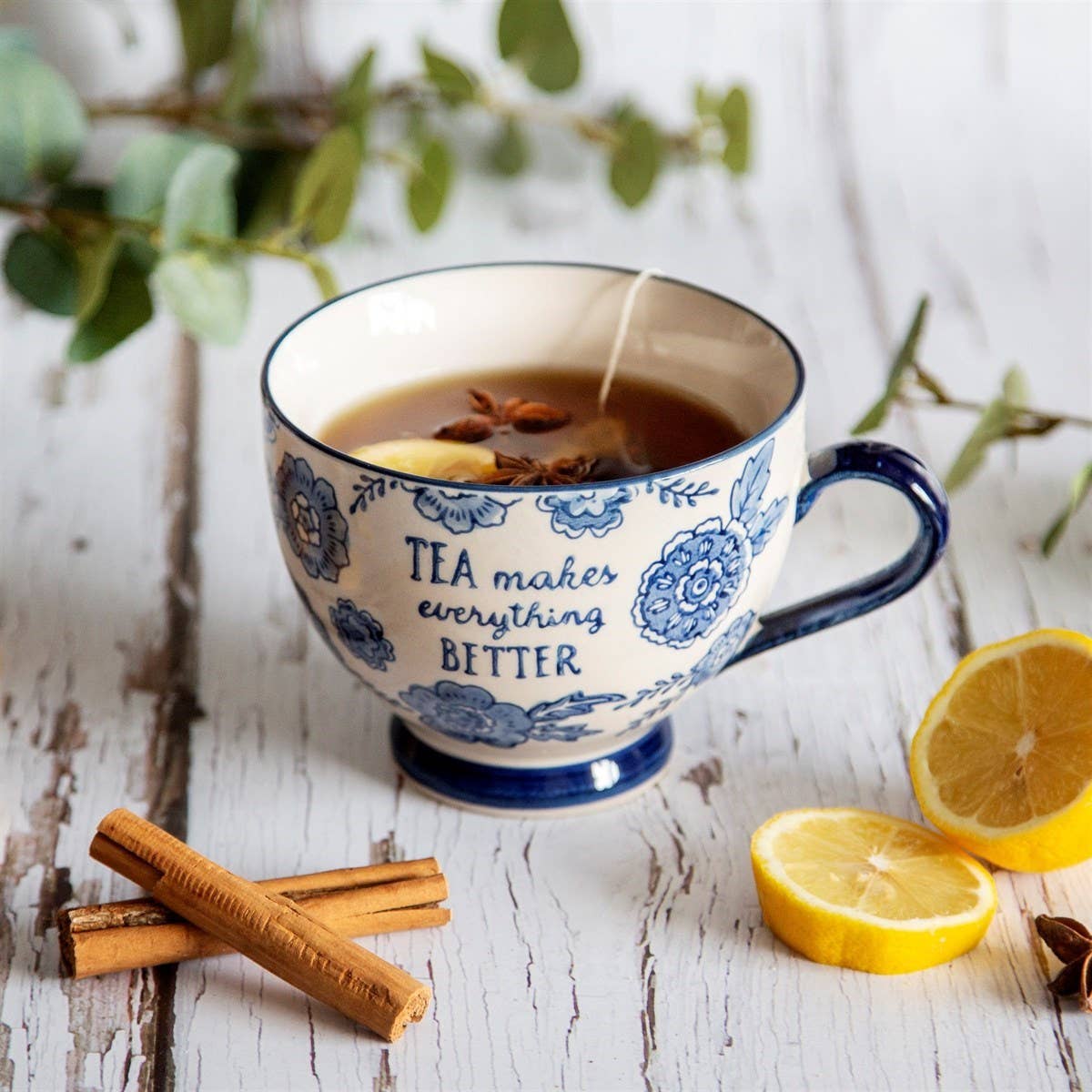 Blue Willow floral ceramic mug with classic blue and white pattern