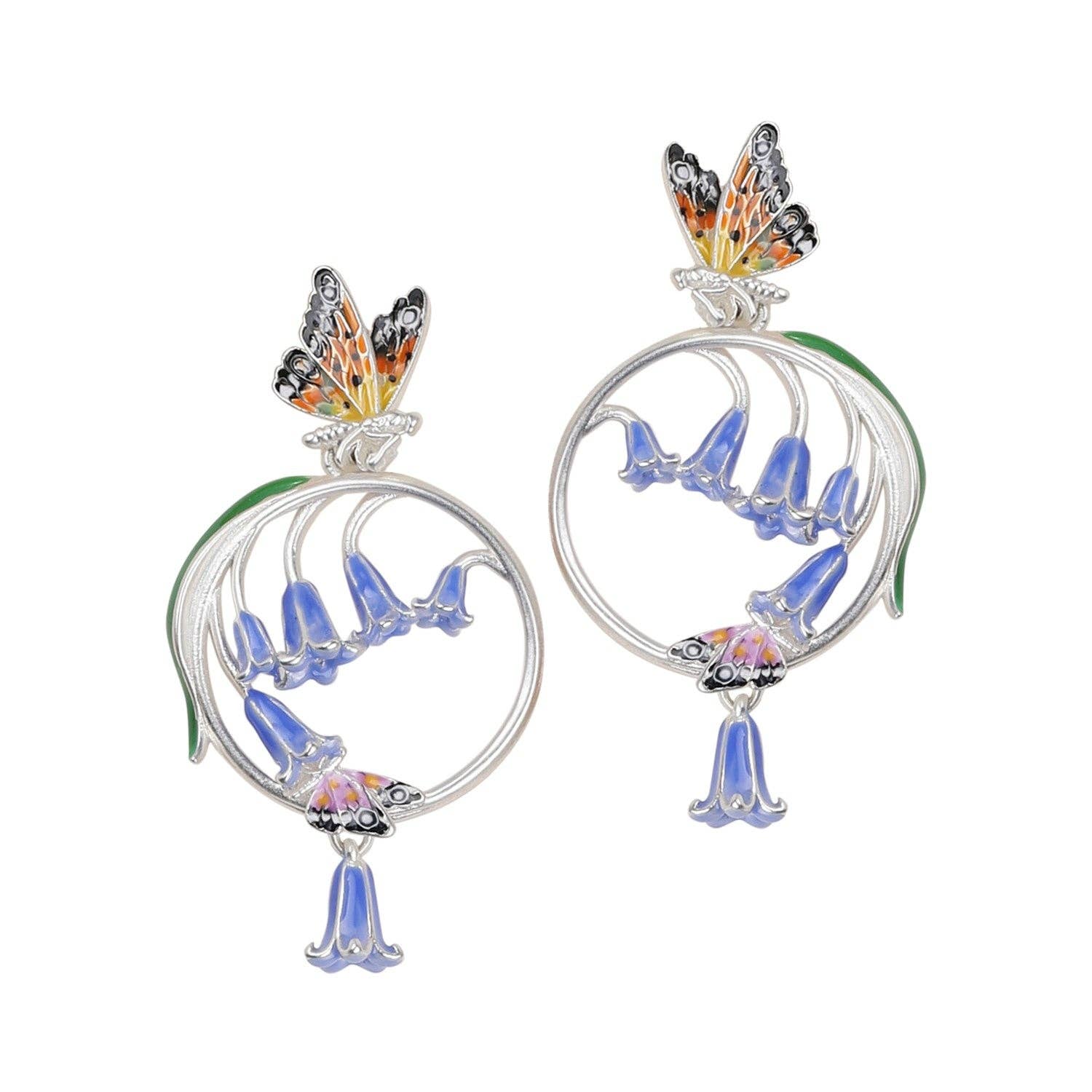 Close-up of Bluebell & Butterfly Hoop Earrings in enamel and rhodium finish by Bill Skinner on white background.