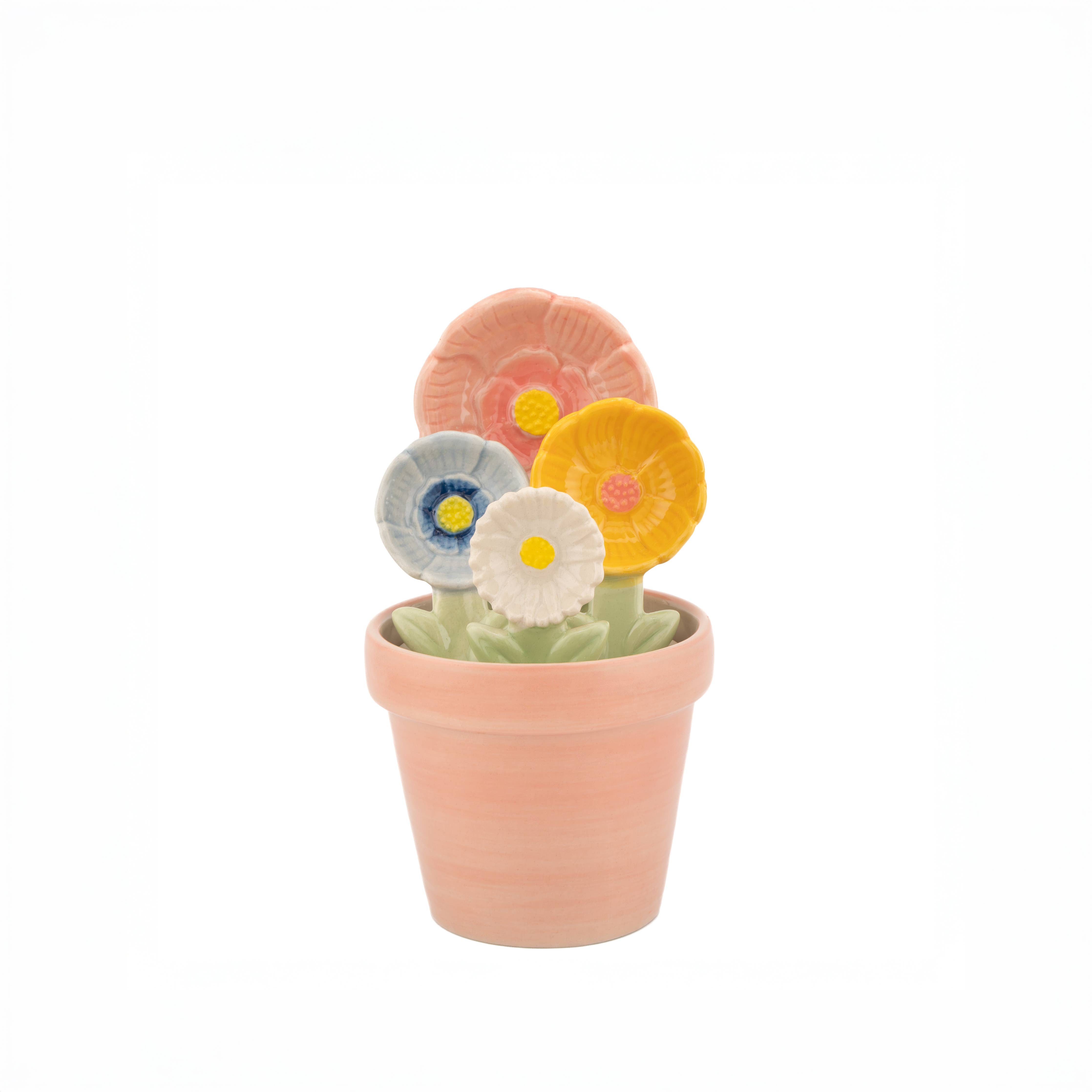 Close up of ceramic flower measuring spoons with detailed petal designs