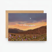 Greeting card with a sunset over a field and 'with deepest sympathy' text.
