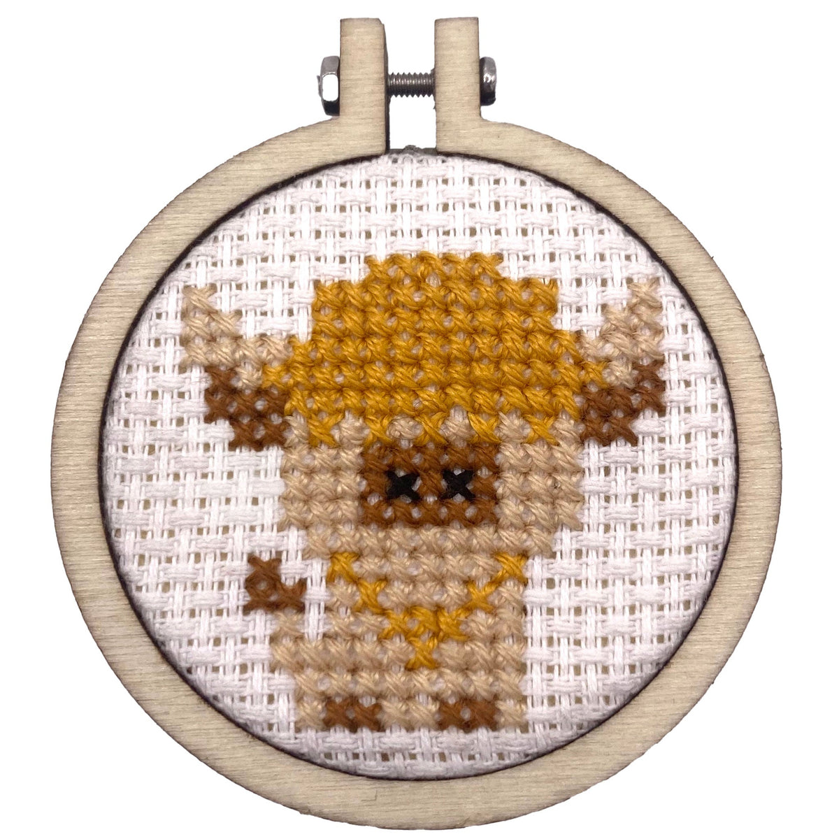 Finished Highland cow cross stitch in a 5cm wooden hoop on white