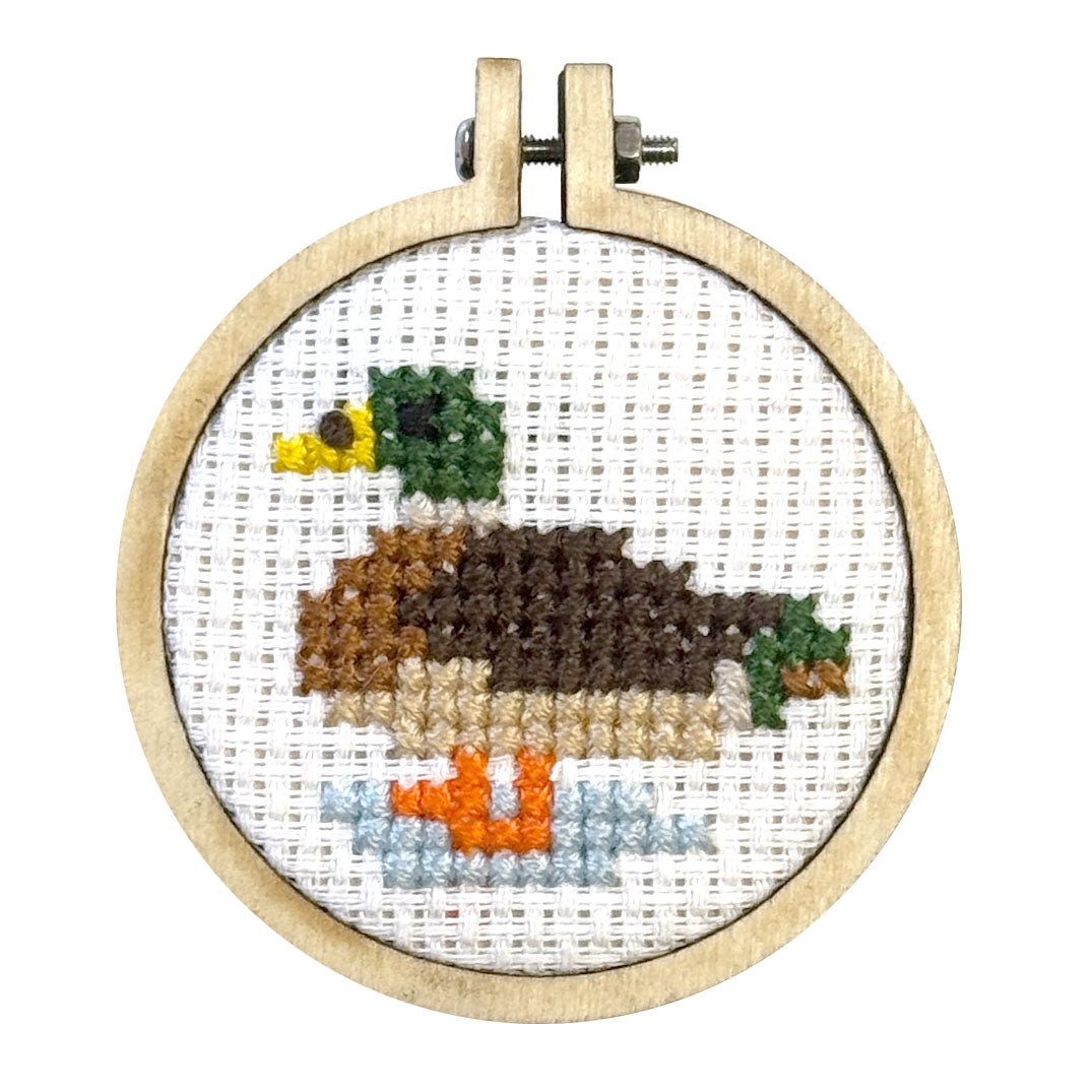 Finished mallard duck cross stitch in a 5cm wooden hoop on white