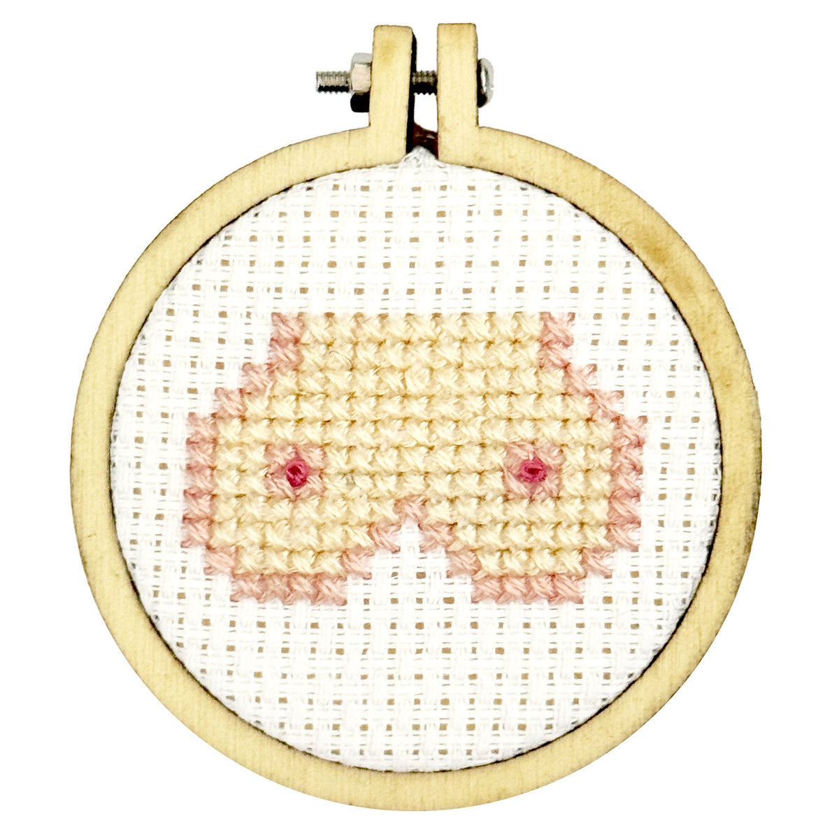 Finished cheeky boobs cross stitch in a 5cm wooden hoop on white