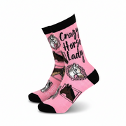Pink socks with horse designs and text on a white background