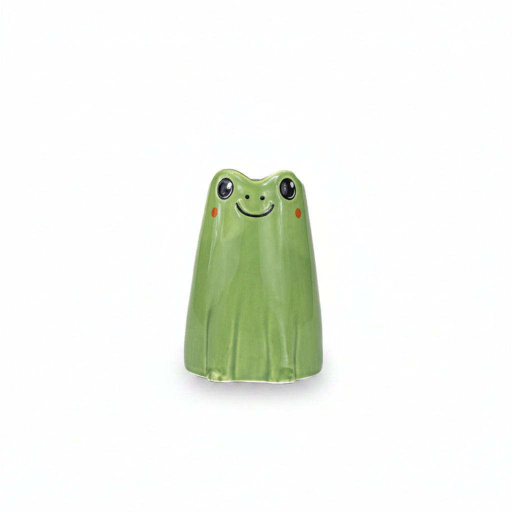 Green frog-shaped object on a white background