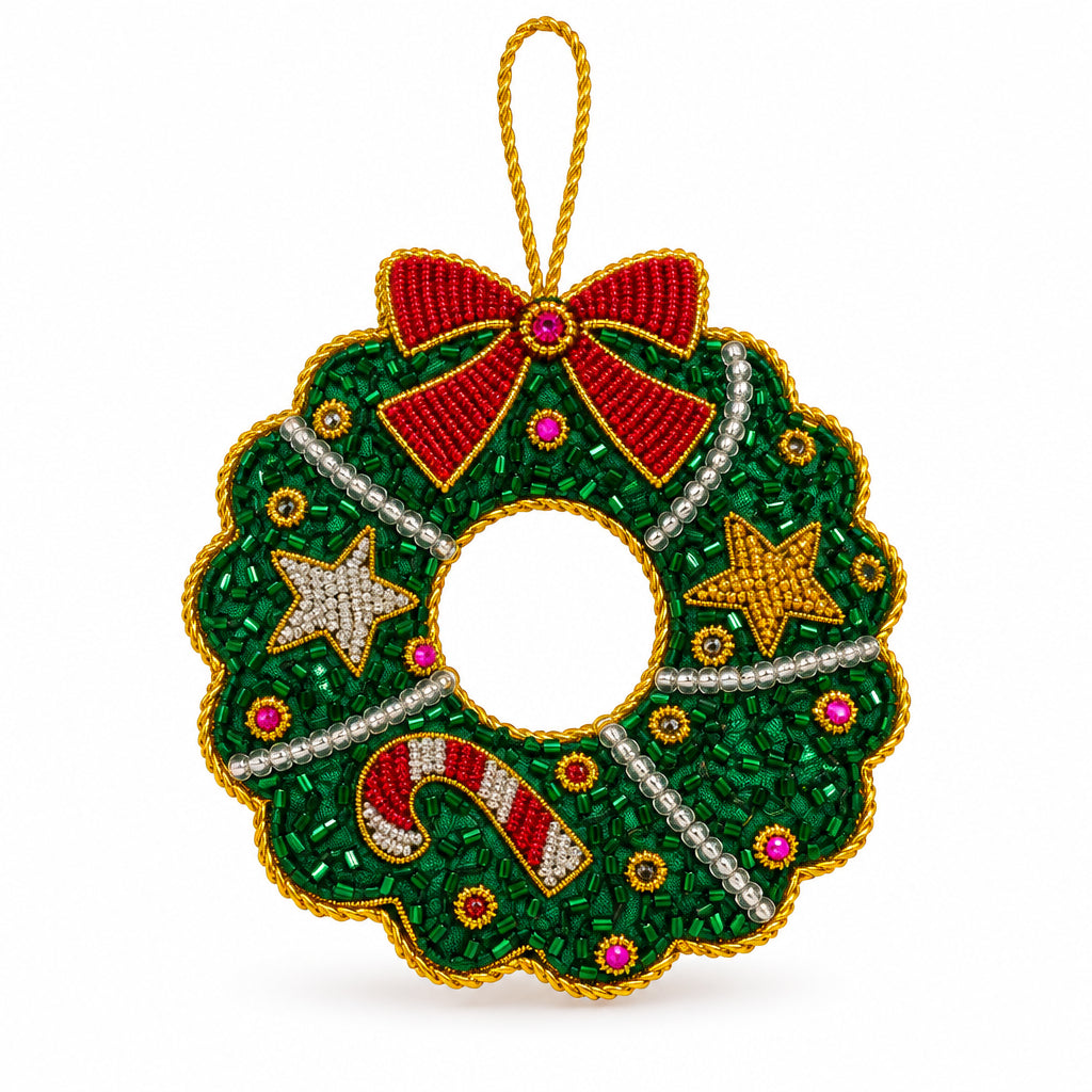 Christmas Wreath embroidered decoration close up, showing the red bow, stars and beads