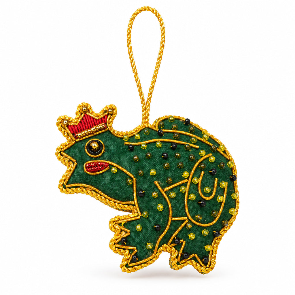 Frog Prince embroidered decoration close up, showing the gold metal thread spots and red crown