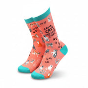 Coral socks with cat patterns and teal accents on a white background