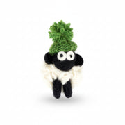 Hand-knitted wool sheep fridge magnet wearing a green bobble hat