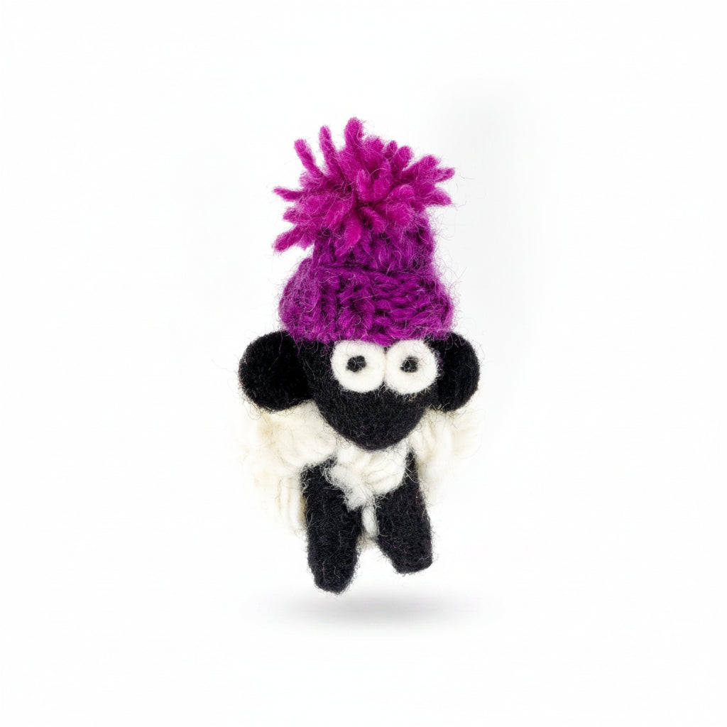 Hand-knitted wool sheep fridge magnet wearing a purple bobble hat