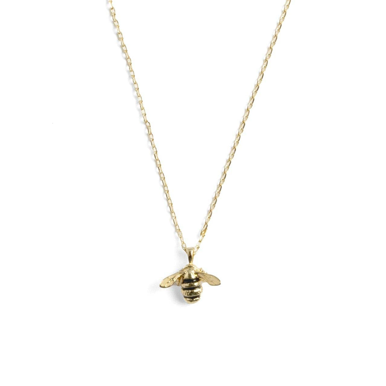 Close-up of bee pendant showing enamel detail