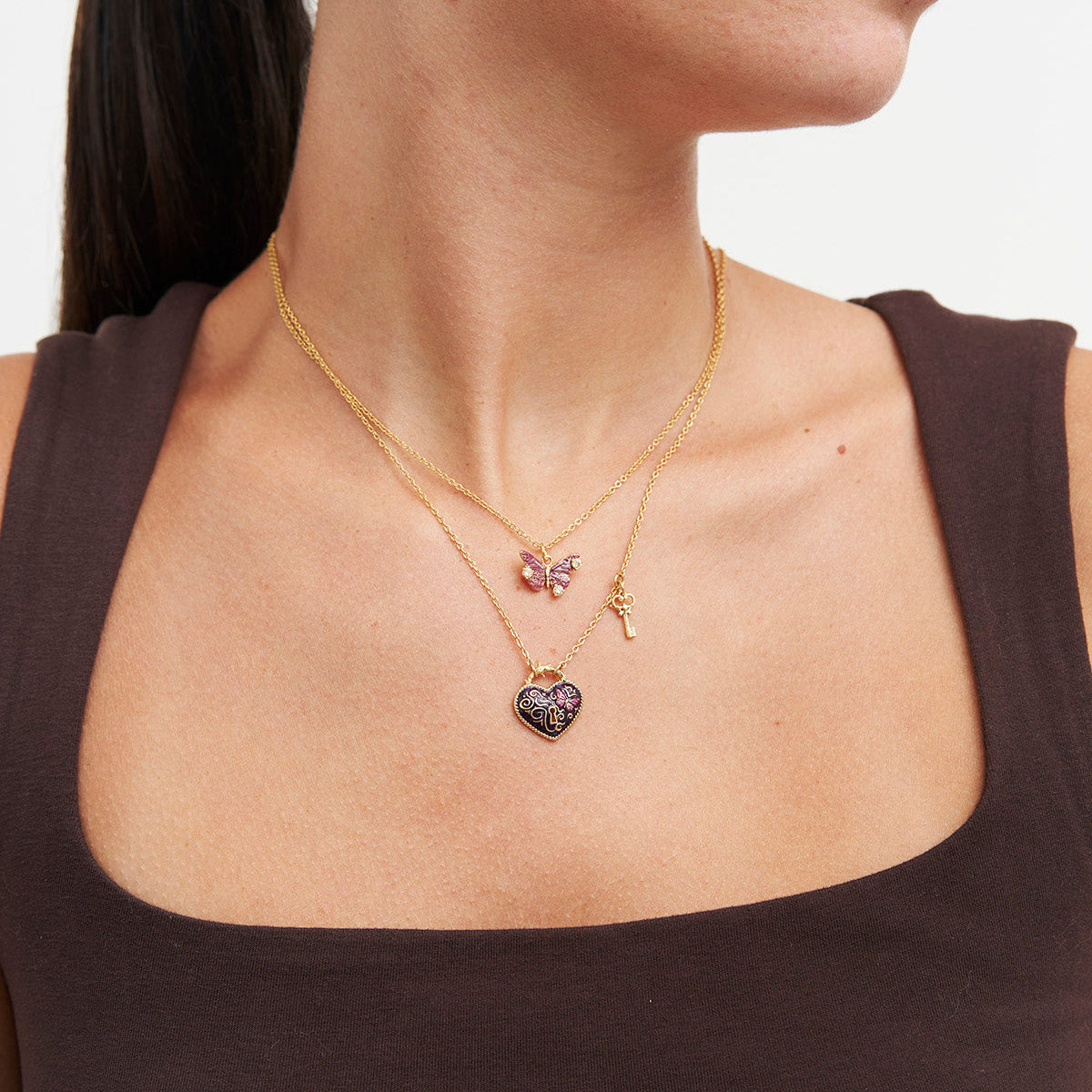 Eve heart lock and key necklace worn by a model