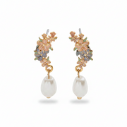 Hibiscus pearl earrings front view on light grey background