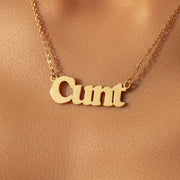 Gold cunt necklace worn around neck on model