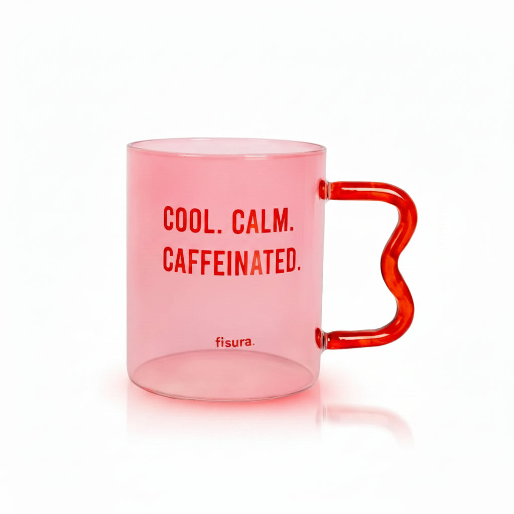 Pink glass mug with red wavy handle and Cool Calm Caffeinated lettering