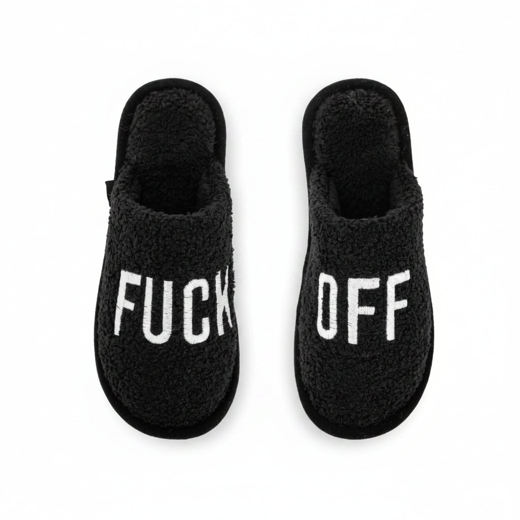 Black fluffy slippers with bold white lettering, side by side