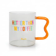 Clear glass mug with rainbow Hotter Than My Coffee lettering and orange handle