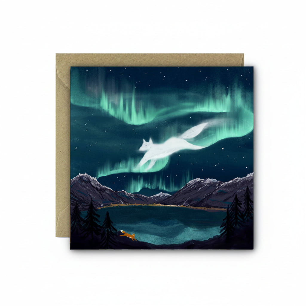 Greeting card with a fox under the Northern Lights over a mountain lake