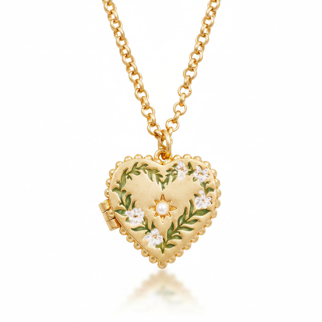 Close-up of Gaia Lily Heart Locket Necklace with hand-painted enamel lilies and faux pearl detail.