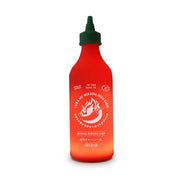 Chilli Sauce Lamp glowing red on a dark background