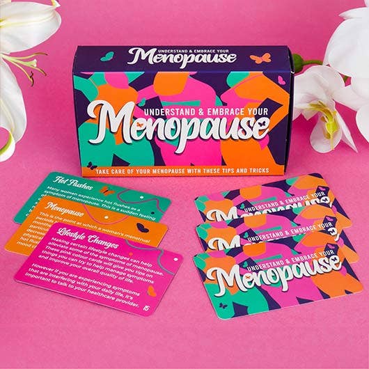 Menopause Cards box and tip cards on a pink background with flowers