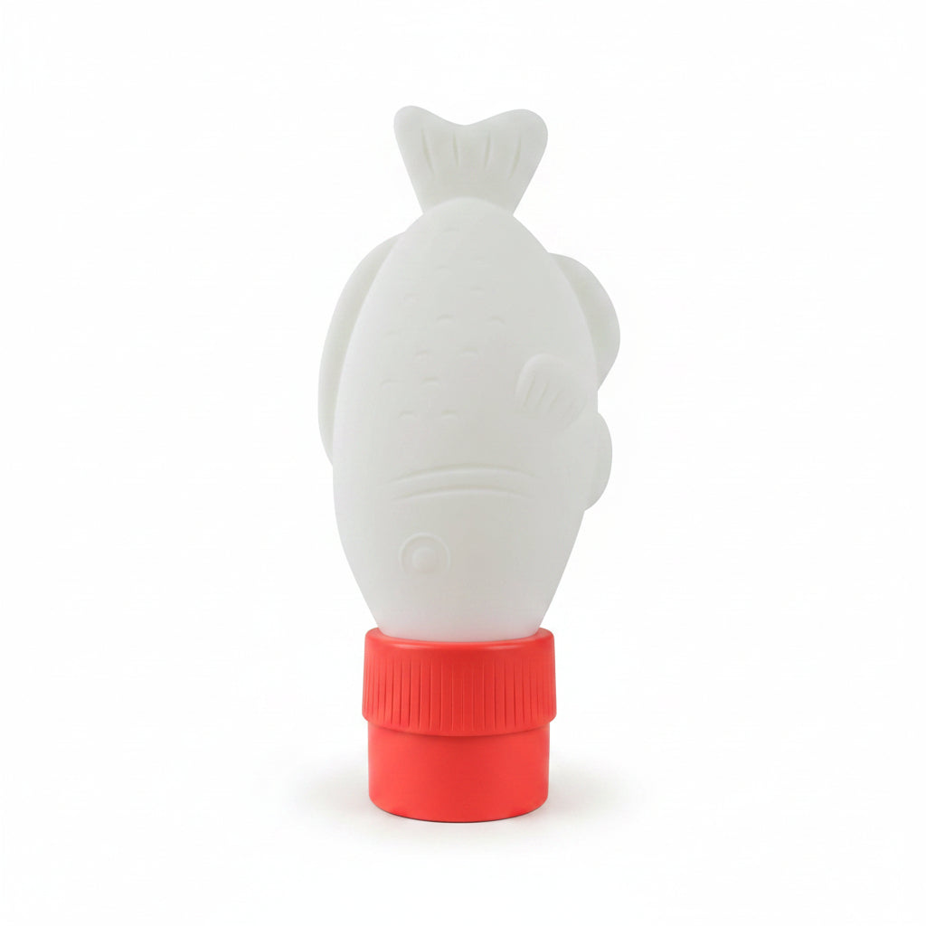 Soy sauce fish light with its red cap beside the retail packaging