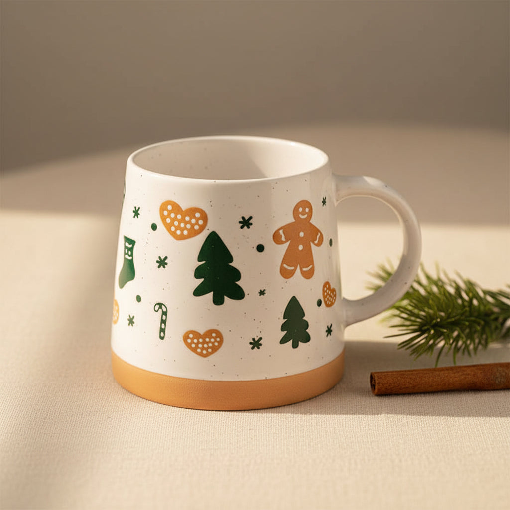 Front angle of Gingerbread Man Tapered Stoneware Mug with festive icons and natural base.