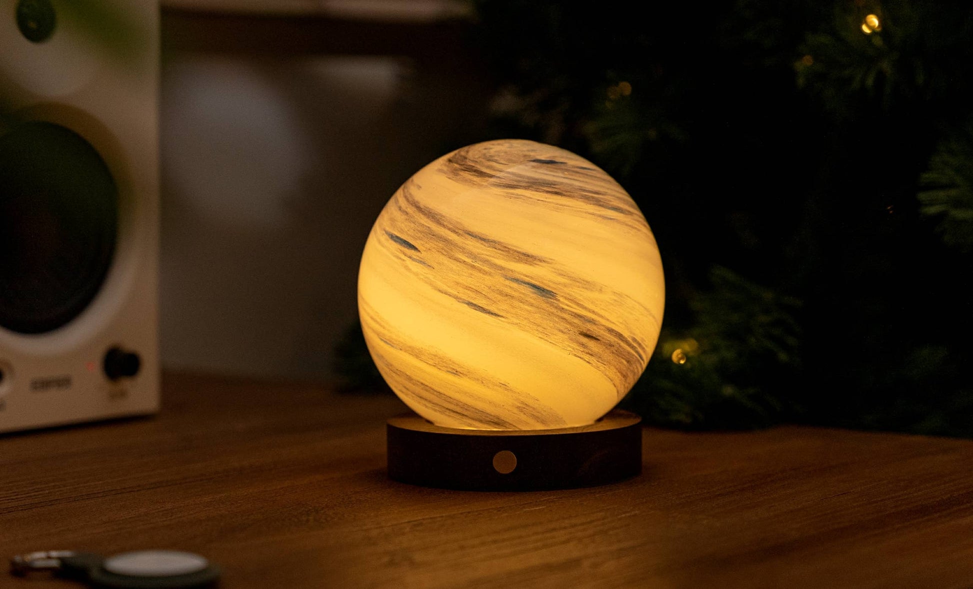 AstraGlass light glowing warm white with grey marbling by tree lights