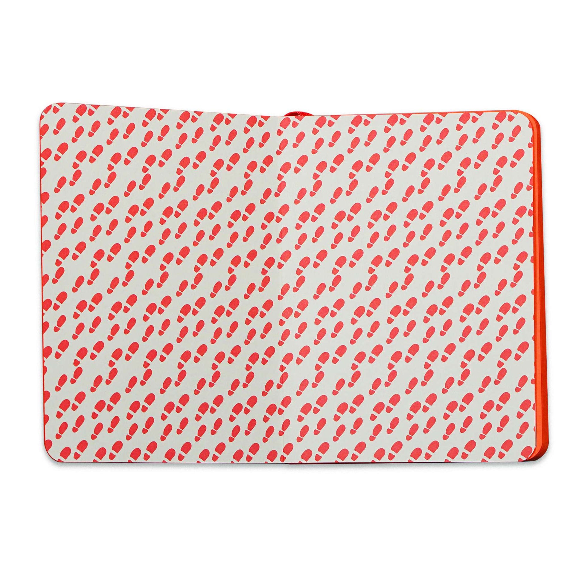 Back cover of the A6 notebook with a repeating red footprint print