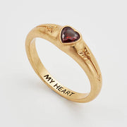 Angled view of the ring showing the red heart stone and My Heart engraving.
