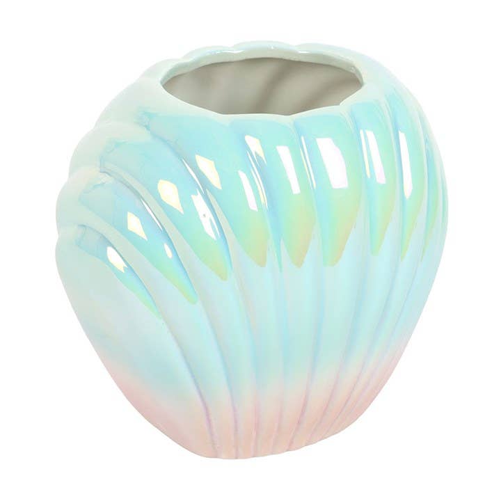 Shell vase with dried flowers showing iridescent glaze