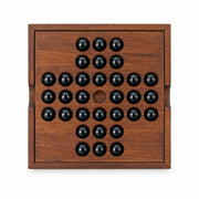 Iron & Glory wooden solitaire board, top down with black glass marbles