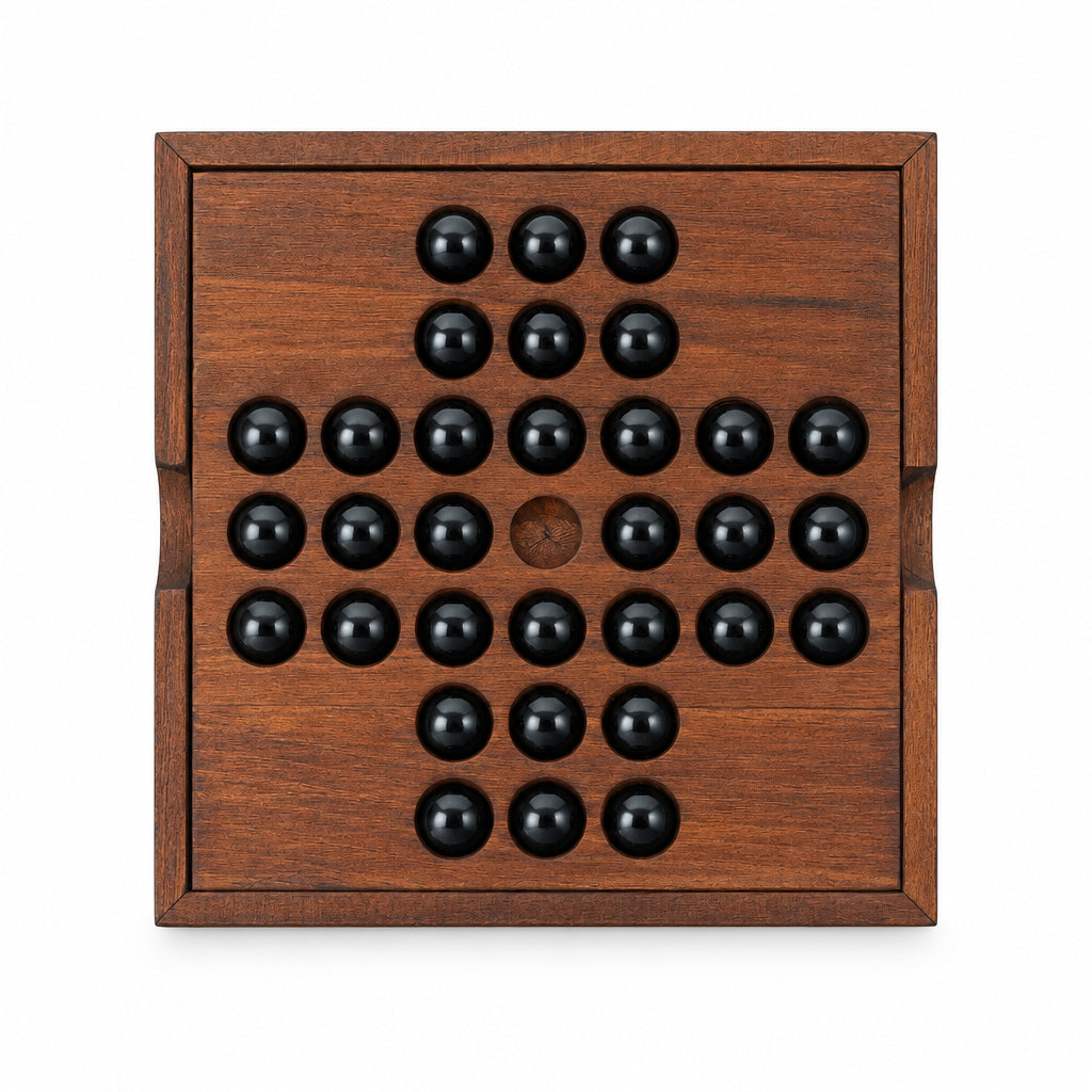 Iron & Glory wooden solitaire board, top down with black glass marbles