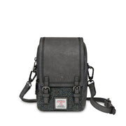 Black and grey herringbone Baby Jura crossbody shown at an angle