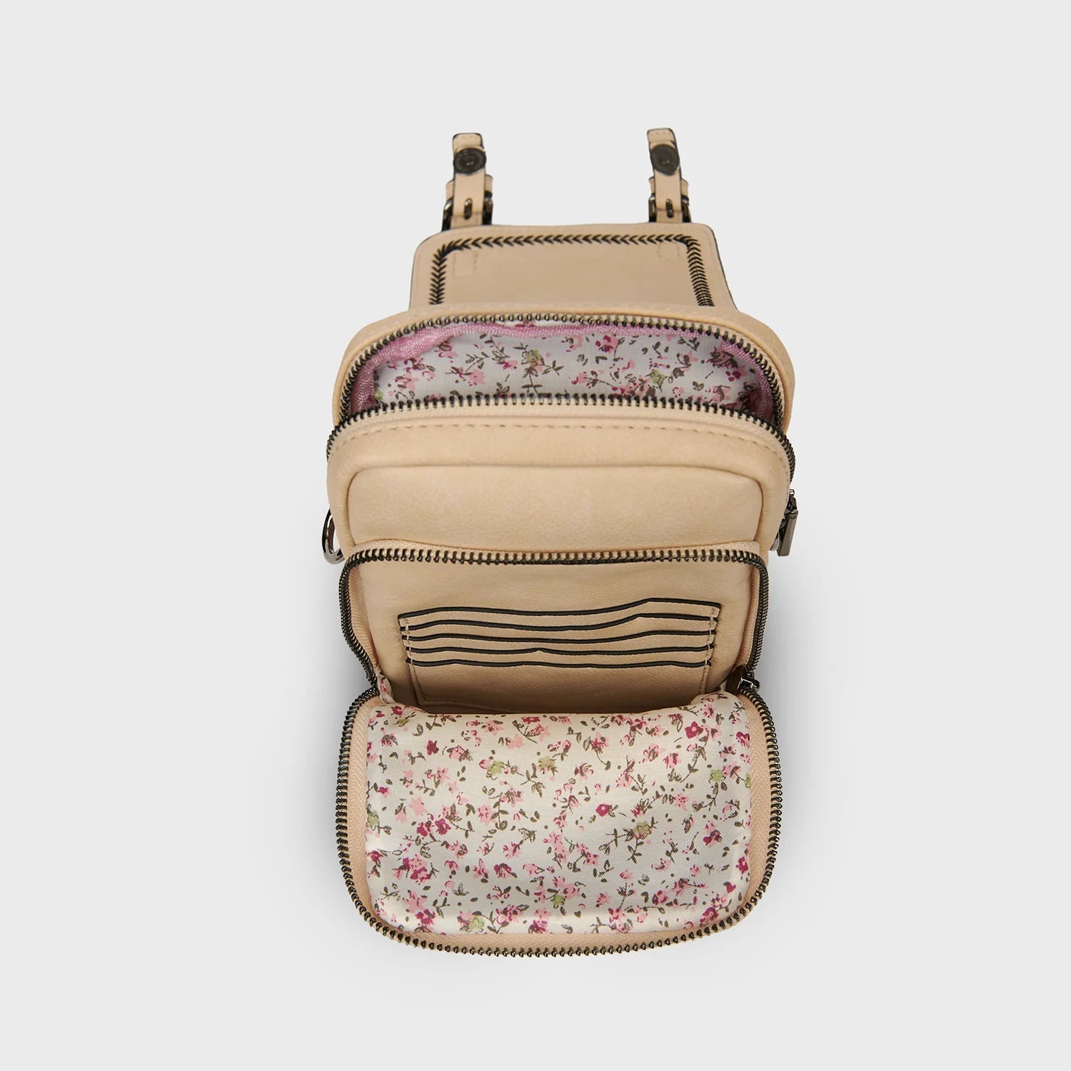 Islander crossbody bag interior open showing floral lining and card slot pocket