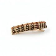 Beige dogtooth Harris Tweed barrette clip angled on white background