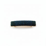 Black and grey herringbone Harris Tweed barrette on white background