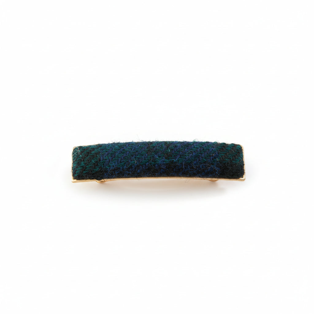 Black and grey herringbone Harris Tweed barrette on white background