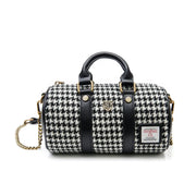 Mini dogtooth Harris Tweed duffel bag with gold chain front view