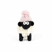 Hand-knitted wool sheep figure wearing a pink bobble hat