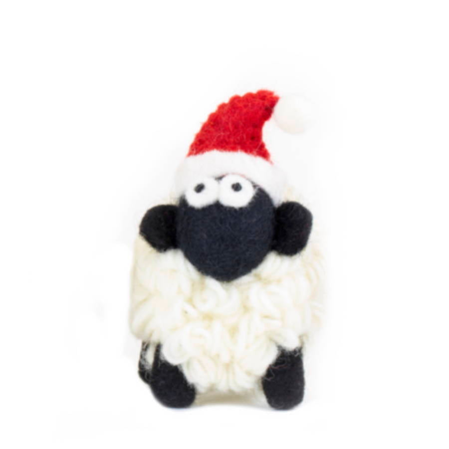 Small felted sheep in a red Santa hat with looped cream fleece, front view
